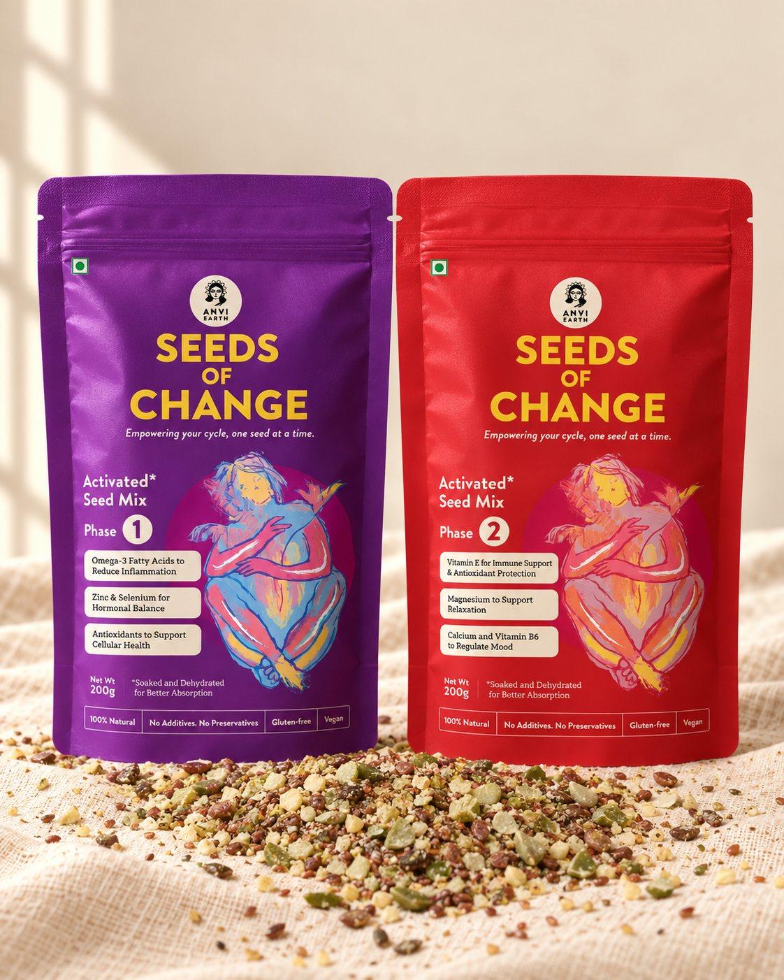 Seeds of Change Phase 1 and Phase 2 pouches standing together on cream linen, seeds scattered at their base